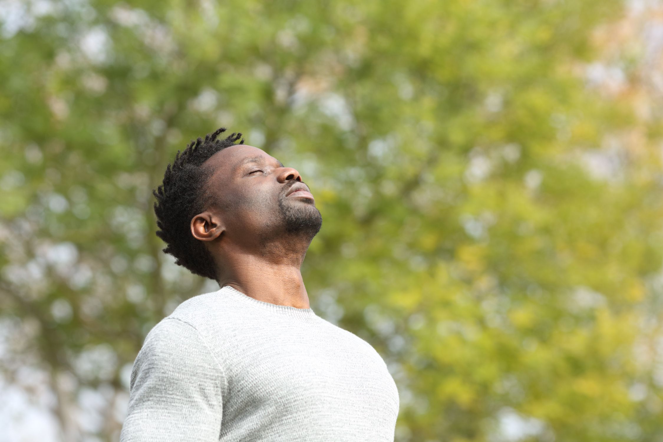 Man practicing deep breathing and self-awareness practices for emotional regulation